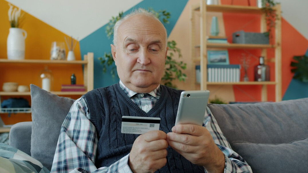 elderly person using smartphone